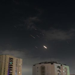 TEL AVIV, April 14, 2024  -- This photo taken on April 14, 2024 shows flares from explosions in the sky over Tel Aviv as Israel's anti-missile system intercepts missiles and drones from Iran. A combined attack of dozens of ballistic missiles and hundreds of drones from Iran triggered air raid alerts across Israel early on Sunday, the Israeli army said, as residents reported multiple bombings were heard.
   Israel Defense Forces (IDF) Spokesman Daniel Hagari confirmed during a press briefing that Israel was under attack by ballistic missiles and unmanned aerial vehicles from Iran, noting that aerial defense systems have intercepted some of the missiles.,Image: 864624593, License: Rights-managed, Restrictions: , Model Release: no, Credit line: Tomer Neuberg/JINI / Xinhua News / Profimedia